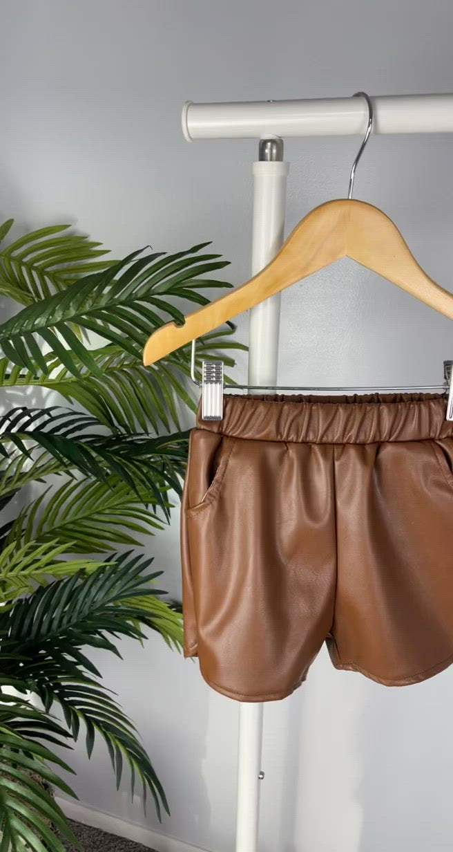 Load and play video in Gallery viewer, Meet Me At Brunch Toddler Girl PU Leather Shorts (Camel Brown)
